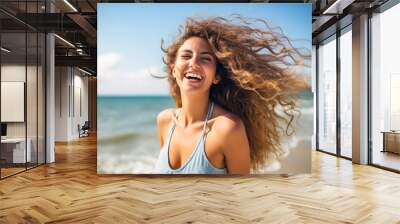 Portrait of a very happy young woman loving the life shes living  having fun on the beach with the surf in the background having fun relaxing no cares or worries holiday vacation in the sun Wall mural