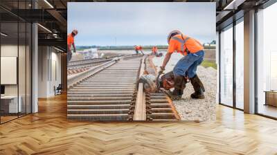 man working rail saw and railroad construction Wall mural