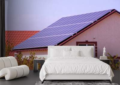 Solar panels on the roof of house. Wall mural