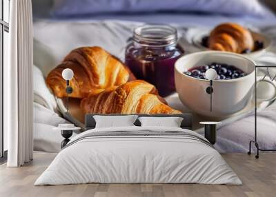 breakfast in bed with freshly baked croissants with blueberry jam and tea in a mug Wall mural