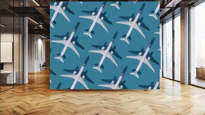 Airplane background. Flights, travel and aviation. Pattern of white planes on a blue background. The passenger plane is flying. Air transport concept. Wall mural