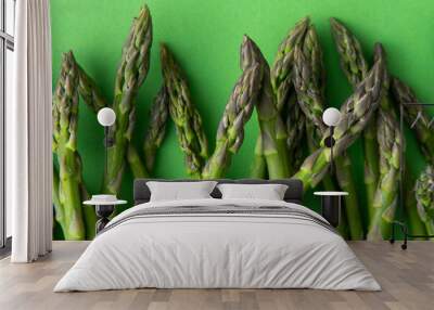 Green asparagus background. Fresh spring vegetable sprouts Wall mural