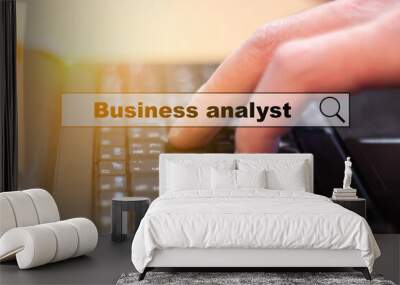 The man makes business analytics on the computer. Wall mural