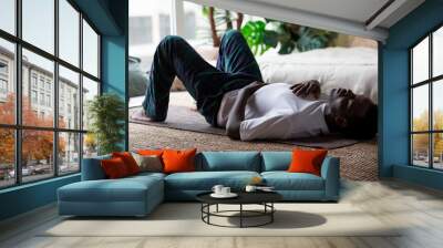 African adult man relax after working out breathing. Wall mural