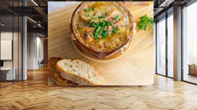 French Onion Soup. Classic traditional french restaurant bistro menu item. French onion soup, yellow onions reduced in broth topped with cheese melted and served with homemade baguettes.  Wall mural