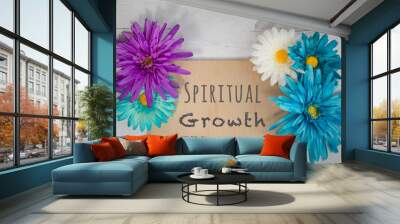 wooden sign spiritual growth written on board surrounded by spring bright colorful flowers flat lay  Wall mural