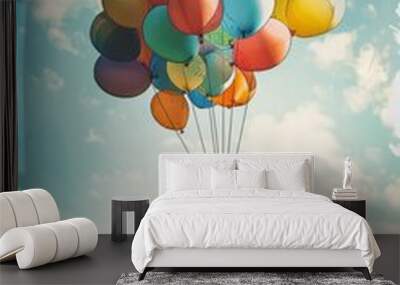 children being lifted towards sky by balloons Wall mural