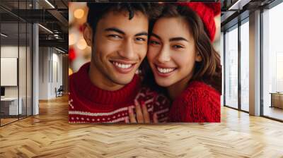 Couple for Valentine's Day looking happy with smiles on their face, red background Wall mural