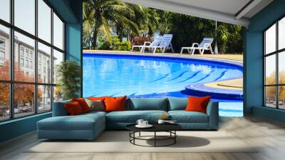 luxury swimming pool with sundeck white close up in tropical gar Wall mural