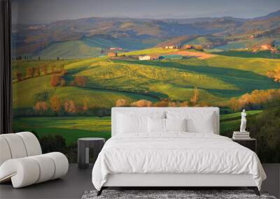 Summer rural landscape of rolling hills, curved roads and cypresses of Tuscany, Italy Wall mural