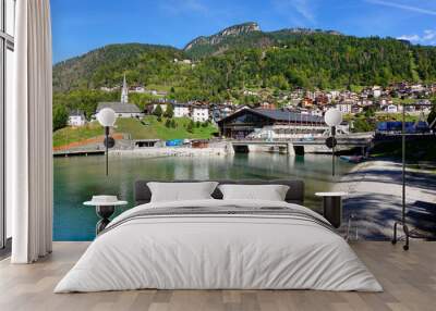 Touristic view of Alleghe resort in the italian Dolomites on bright autumn day, Europe Wall mural