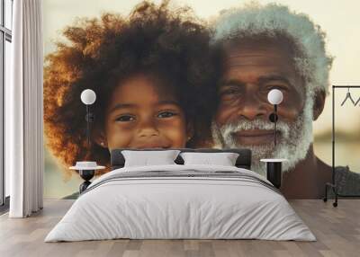 A father and daughter smile together at the beach, holding their adorable cat and enjoying a beautiful sunset Wall mural