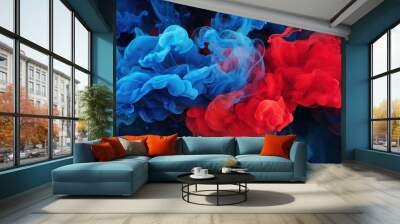 Blue and red paint in water on black background Wall mural