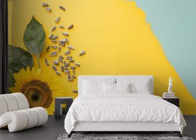 Sunflower blooms beside scattered seeds on a lively yellow and green backdrop, celebrating the essence of summer's bounty Wall mural