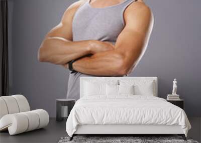 Athletic young man in tank top Wall mural