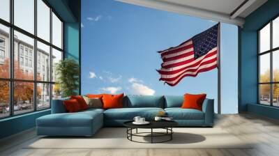 American flag blowing in the wind on the blue sky Wall mural