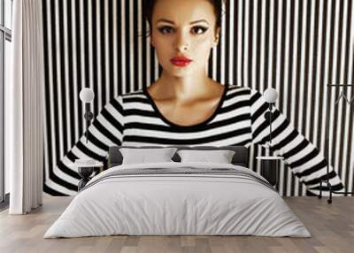 fashion woman in striped dress in studio Wall mural