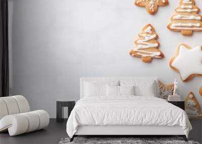 Decorated Christmas cookies arranged on a marble surface for festive celebrations Wall mural