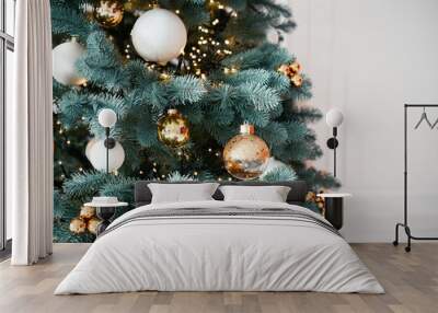 Decorated Christmas tree with ornaments in a cozy, festive living room Wall mural