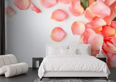 Delicate pink rose petals scattered on a soft white surface for a serene decorative display Wall mural