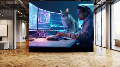 A software engineer works at a computer and a cat sits on a table Wall mural