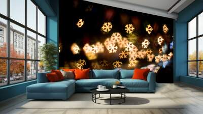 Blurred abstract background christmas light with snow flake ligh Wall mural