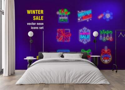 Winter sale neon signs set. Shopping bags, bauble, gift box, snowflake. Night bright advertising. Vector illustration in neon style for retail banners, Christmas posters, discount flyers design Wall mural