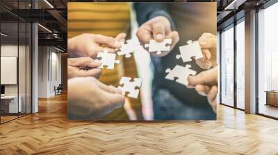 A group of business people assembling jigsaw puzzle. Wall mural