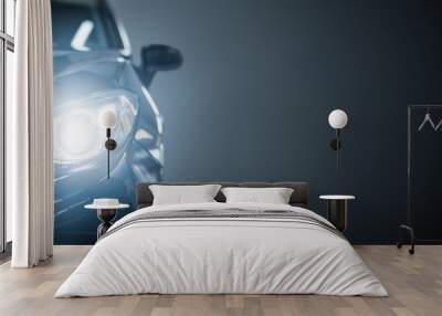 Black modern car on black background. Wall mural