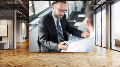 Business people negotiating a contract. Wall mural