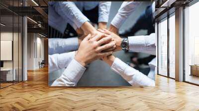 Stack of hands. Unity and teamwork concept. Wall mural