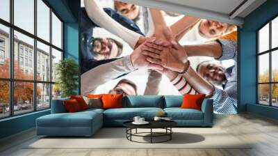 Stack of hands. Unity and teamwork concept. Wall mural