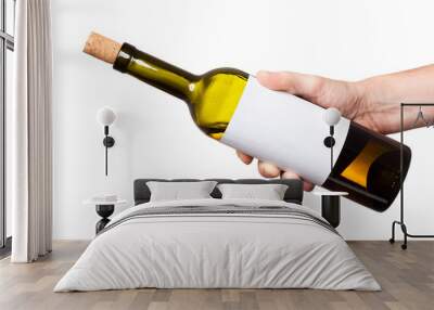 bottle of white wine in his hand isolated on white background Wall mural