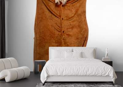 A pretty girl in a funny brown kigurumi featuring poop emoji on the hood. The attractive blonde frolicking  and raising her arms while posing on the white background. Ready for great slumber party.  Wall mural