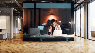 Business woman, stress and laptop in office for corporate communication, internet research and networking. Female person, technology and frustrated working late night for project planning and email Wall mural