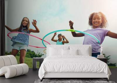 Portrait, hula hoop and kids in park, girls and happiness with fun, bonding together and playful. Childhood, outdoor or friends with recreation, game or cheerful with weekend break, summer or leisure Wall mural