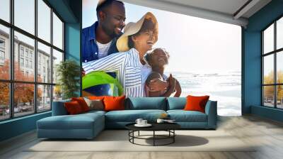 Black family, children or beach with a mother, father and daughter carrying a ball, walking on sand by the sea. Love, nature and ocean with a man, woman and girl child playing on the coast in summer Wall mural