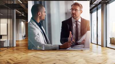 Business people, talking and tablet for planning online with partner for marketing strategy. Men in management speaking and discussion at table about ideas for corporate collaboration in office Wall mural