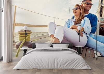 Smile, happy and couple on a yacht at sea, summer travel and ocean adventure in Spain. Peace, hug and man and woman on a boat for a luxury cruise, sailing and happiness on holiday on the water Wall mural