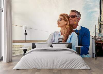 Yacht, travel and love with a mature couple sitting together on a boat out at sea for a romantic date. Luxury, ocean or summer with a married man and woman on a ship to relax during a trip Wall mural