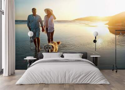 Beach, water and couple with dog at sunset for outdoor adventure, travel and vacation together. Man, woman and holding hands with furry pet by ocean for love, support and summer holiday in Cancun Wall mural