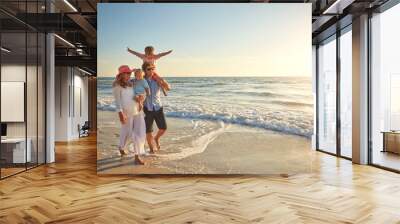 Happy family, beach holiday and walking, smile for vacation on tropical island. Man, woman and children together with sunglasses by ocean for travel with wellness, mockup space at sunset in Mauritius Wall mural