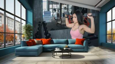 Beautiful asian woman play fitness in the gym,Thailand girl has a slim body,Time for exercise,People love heathy Wall mural