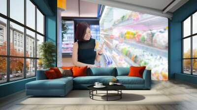 Beautiful asian woman walking shopping in a supermarket,Time for relax,Buy for dinner,Thailand people,Happy time lifestyle concept Wall mural