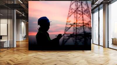 Silhouette of asian engineer working on sunset,Thailand people work on sunset Wall mural