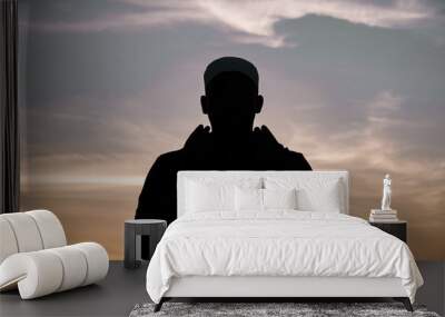 Silhouette Young asian muslim man praying on sunset,Ramadan festival concept Wall mural