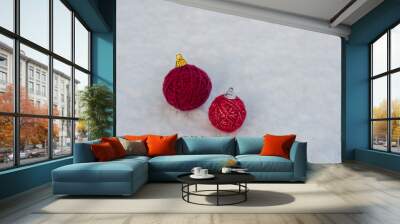 Christmas tree decoration made of red yarn ball on natural snow background. Minimal New year  or Christmas concept with creative copy space. Wall mural