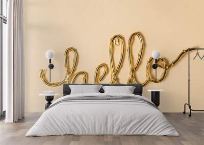 Golden Hello sign on a bright surface Wall mural