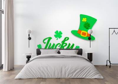 Lucky lettering decorated with cloverleafs and Leprechaun’s hat. Saint Patricks day greeting card. Space for text. Soft focus. Top view. Wall mural