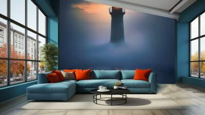 A lone lighthouse standing tall in a foggy sea at dusk Wall mural